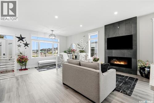 701 Casper Crescent, Warman, SK - Indoor Photo Showing Living Room With Fireplace