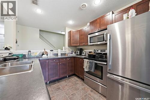 210 515 28Th Street E, Prince Albert, SK - Indoor Photo Showing Kitchen With Stainless Steel Kitchen With Double Sink