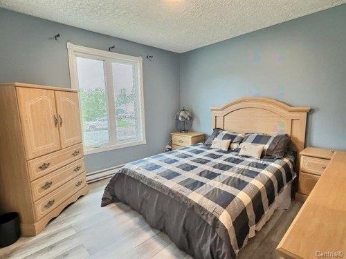 Chambre à coucher principale - 69 10E Avenue O., Palmarolle, QC - Indoor Photo Showing Bedroom