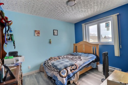 Chambre à coucher - 69 10E Avenue O., Palmarolle, QC - Indoor Photo Showing Bedroom