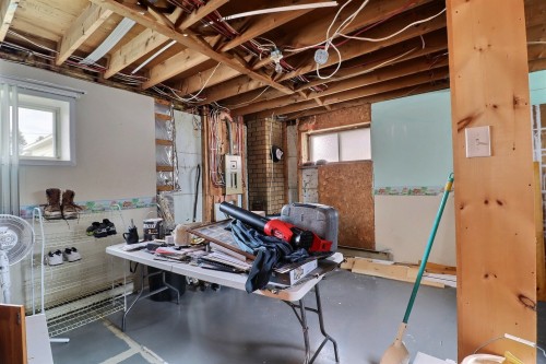 Salle familiale - 69 10E Avenue O., Palmarolle, QC - Indoor Photo Showing Basement