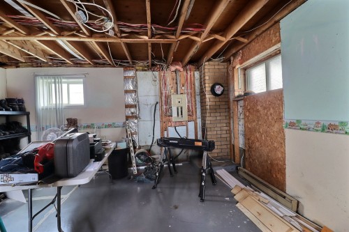 Salle familiale - 69 10E Avenue O., Palmarolle, QC - Indoor Photo Showing Basement