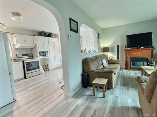 Vue d'ensemble - 69 10E Avenue O., Palmarolle, QC - Indoor With Fireplace