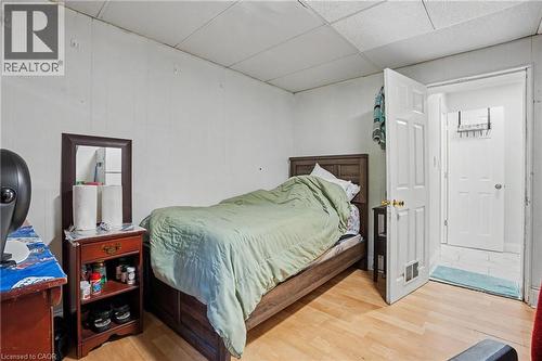 Room with light wood-finish flooring and white paneled walls - 47 Bowman Street, Hamilton, ON - Indoor Photo Showing Bedroom