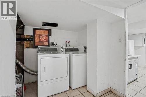 Dedicated laundry area featuring white appliances and tiled flooring - 47 Bowman Street, Hamilton, ON - Indoor Photo Showing Laundry Room
