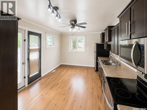 1410 4Th Avenue N, Regina, SK - Indoor Photo Showing Kitchen With Double Sink