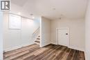 Finished lower level with wood-finish flooring, recessed lighting, and white baseboards - 16 Ronaldshay Avenue, Hamilton, ON  - Indoor Photo Showing Other Room 