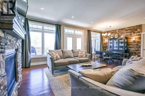 2 Roy Hickling Drive, Springwater, ON - Indoor Photo Showing Living Room With Fireplace