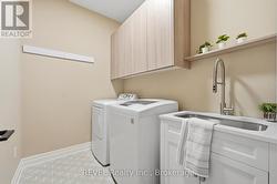 Main floor laundry with built-in drying rack - 