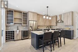 oversized kitchen with cabinets to the ceiling - 