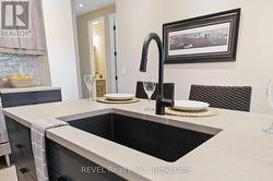 Island with stone counters & extra large sink - 