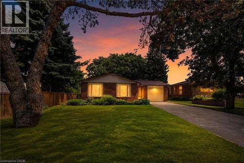 Brick exterior with a prominent front lawn and mature trees - 3 Orchard Parkway, Grimsby, ON - Outdoor