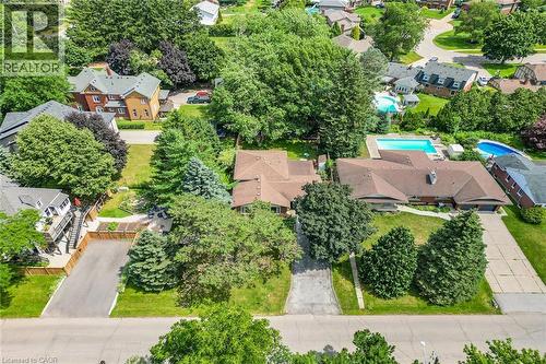 Aerial perspective showcasing a property with a brown shingled roof, a paved driveway, and mature landscaping - 3 Orchard Parkway, Grimsby, ON - Outdoor With View