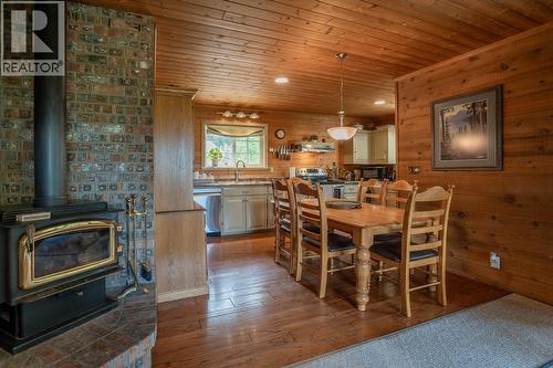 6650 Ryall Road, Lone Butte, BC - Indoor Photo Showing Dining Room With Fireplace