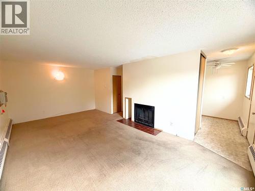 202 15 Alport Crescent, Regina, SK - Indoor With Fireplace