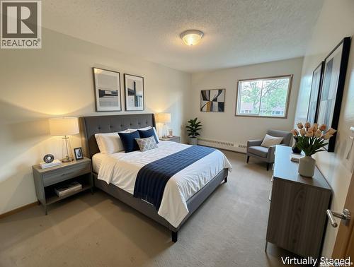 202 15 Alport Crescent, Regina, SK - Indoor Photo Showing Bedroom