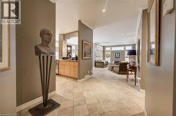 Expansive tiled flooring spans open-concept living spaces - 