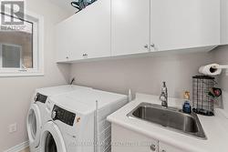 Main Floor Laundry Room W Sink & W/O To Garage - 