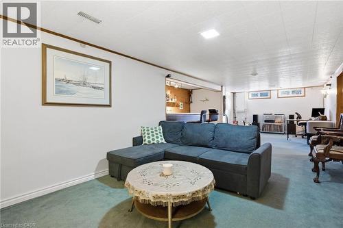 Expansive recreation room featuring green carpeting and white walls - 11 Summit Crescent, Guelph, ON - Indoor Photo Showing Living Room