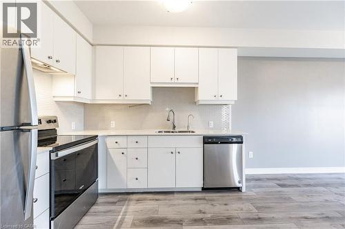 255 Northfield Drive E Unit# 302, Waterloo, ON - Indoor Photo Showing Kitchen With Double Sink