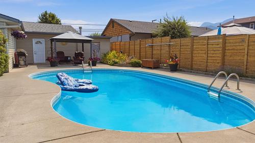 9694 School Road, Coldstream, BC - Outdoor With In Ground Pool With Backyard