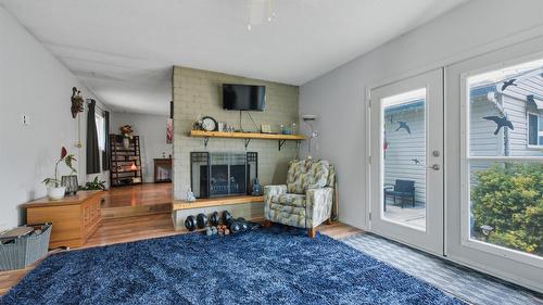 9694 School Road, Coldstream, BC - Indoor Photo Showing Living Room With Fireplace