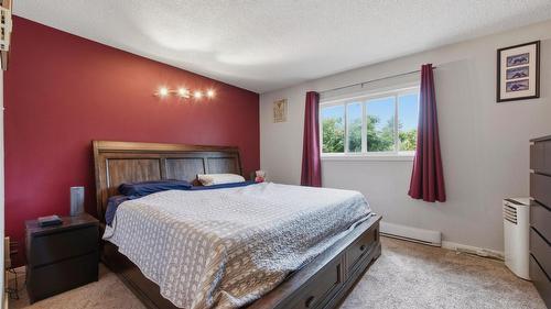 9694 School Road, Coldstream, BC - Indoor Photo Showing Bedroom