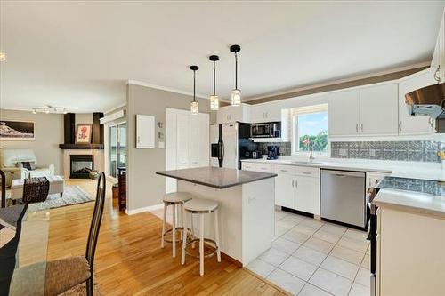 108-60 Dunkirk Dr, Winnipeg, MB - Indoor Photo Showing Kitchen With Fireplace With Upgraded Kitchen