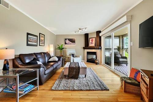 108-60 Dunkirk Dr, Winnipeg, MB - Indoor Photo Showing Living Room With Fireplace
