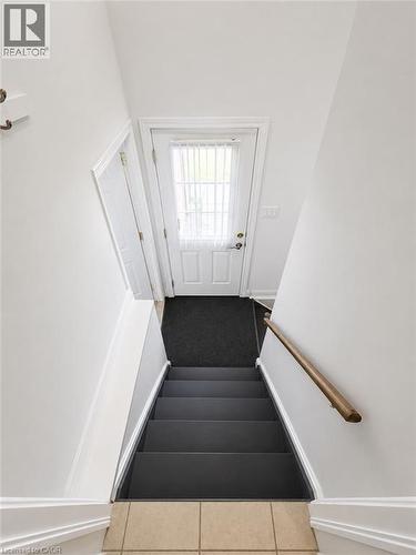 Entrance to lower level w/separate entrance & garage access - 7 Spitfire Drive, Mount Hope, ON - Indoor Photo Showing Other Room