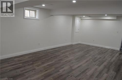 Spacious room featuring wood-finish flooring, recessed lighting, and white baseboards - 275 Locheed Drive Unit# Lower, Hamilton, ON - Indoor Photo Showing Other Room