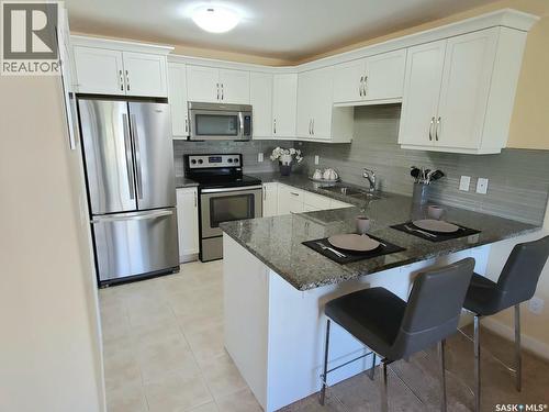 4665 Skinner Crescent, Regina, SK - Indoor Photo Showing Kitchen With Stainless Steel Kitchen