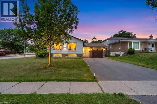 Split-level residence featuring a detached single-car garage with a brown door - 383 Bartley Bull Parkway, Brampton, ON - Outdoor With Facade