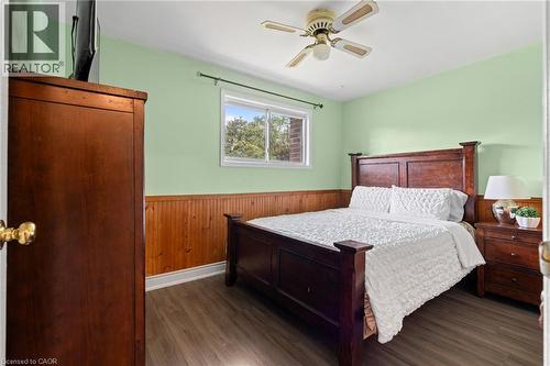 Room featuring wood-finish flooring, a window with exterior visibility, and a ceiling fan - 383 Bartley Bull Parkway, Brampton, ON - Indoor Photo Showing Bedroom