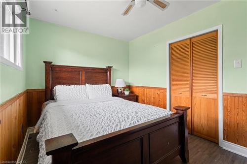 Bedroom featuring wainscoting and wood-finish flooring - 383 Bartley Bull Parkway, Brampton, ON - Indoor Photo Showing Bedroom
