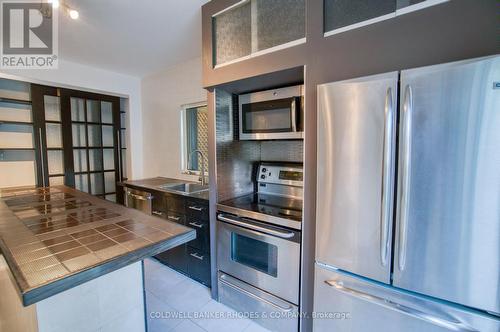 Plenty of storage with pantry closet - 300 St Andrew Street, Ottawa, ON - Indoor Photo Showing Kitchen With Stainless Steel Kitchen