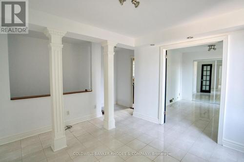 Upstairs has stately columns and tile throughout - 300 St Andrew Street, Ottawa, ON - Indoor Photo Showing Other Room