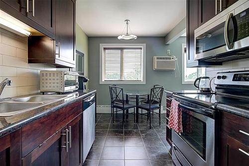 303-23 Lyndale Dr, Winnipeg, MB - Indoor Photo Showing Kitchen With Double Sink