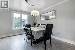 Dining area featuring light gray walls, white trim, and a white plank ceiling - 