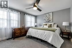 Carpeted room with a ceiling fan featuring integrated lighting - 