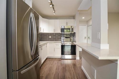 307-710 Kenaston Blvd, Winnipeg, MB - Indoor Photo Showing Kitchen With Stainless Steel Kitchen With Upgraded Kitchen
