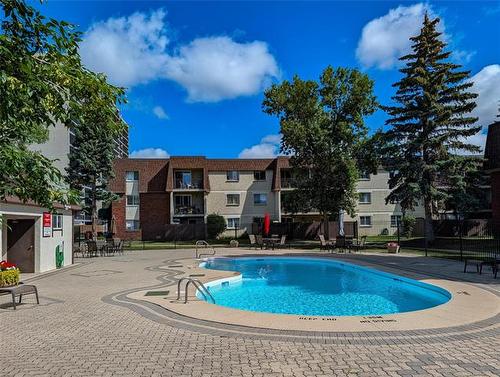 307-710 Kenaston Blvd, Winnipeg, MB - Outdoor With In Ground Pool