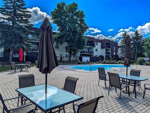 307-710 Kenaston Blvd, Winnipeg, MB - Outdoor With In Ground Pool With Deck Patio Veranda