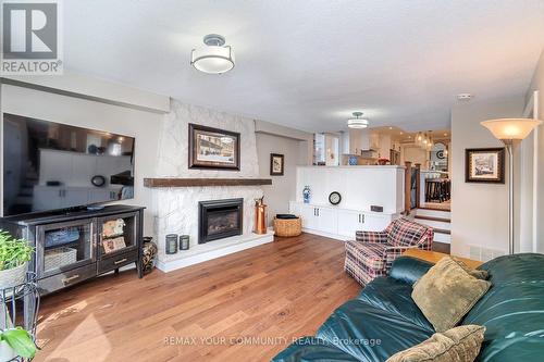 Cozy Family Room - 35 John Dexter Place, Markham, ON - Indoor Photo Showing Living Room With Fireplace