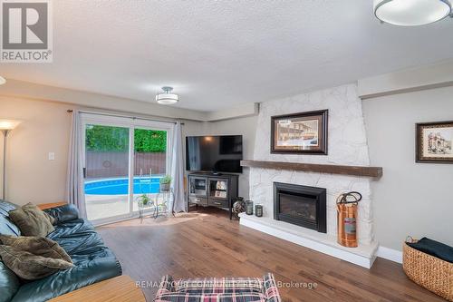 With Walk-Out to Pool - 35 John Dexter Place, Markham, ON - Indoor Photo Showing Living Room With Fireplace