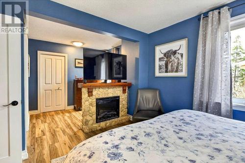 328 East 19Th Street, Hamilton, ON - Indoor Photo Showing Bedroom With Fireplace