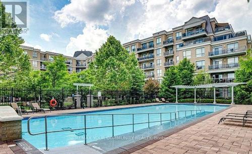 222 - 111 Civic Square Gate, Aurora, ON - Outdoor With In Ground Pool