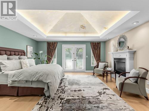 477 Old Orchard Grove, Toronto, ON - Indoor Photo Showing Bedroom With Fireplace