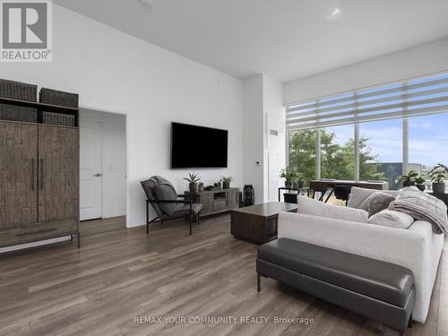 12 foot ceilings throughout - 1012 - 99 Eagle Rock Way, Vaughan, ON - Indoor Photo Showing Living Room