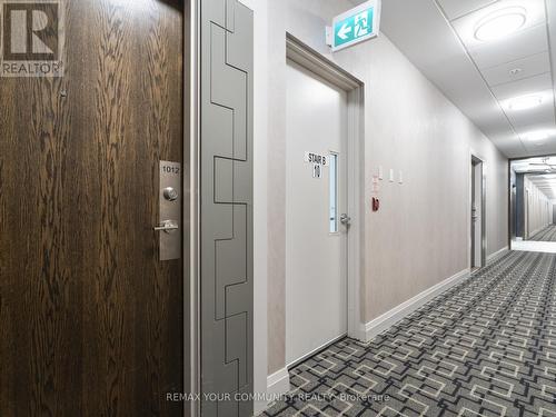 Adjacent to stairwell - 1012 - 99 Eagle Rock Way, Vaughan, ON - Indoor Photo Showing Other Room